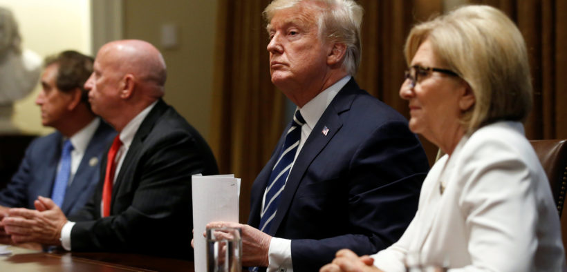 Trump, seeking to calm political storm over Putin summit, says he misspoke
